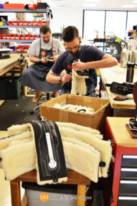 Bold Lead Designs trimming serice dog harnesses at our workshop in Aurora, CO USA